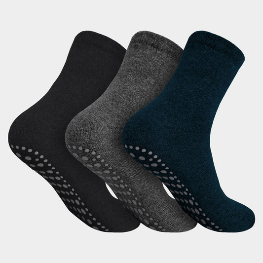 Set van drie Calzera antislip sokken in de kleuren zwart, grijs en blauw, gemaakt van badstof met ABS-materiaal aan de onderkant voor optimale grip.