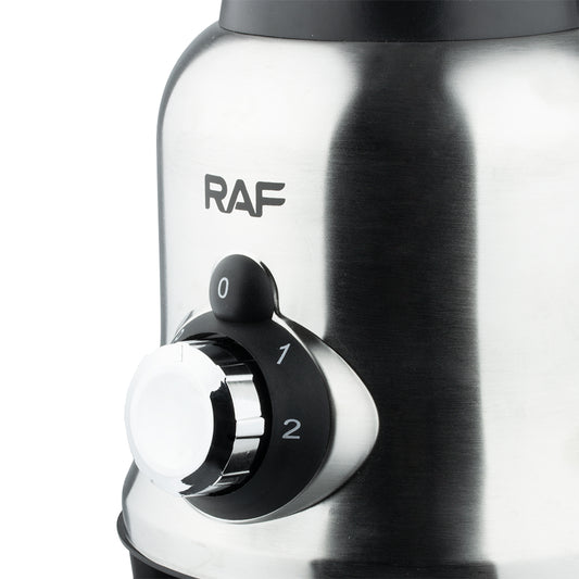 Close-up van de bedieningsknop van de RAF Elektrische Blender, met de standen 0, 1 en 2 voor verschillende snelheidsopties