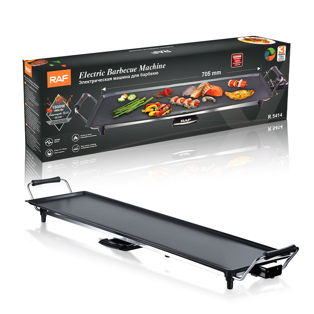Elektrische Teppanyaki grill met 1800W vermogen, afgebeeld met verpakking, ideaal voor barbecueën met vlees, vis en groenten